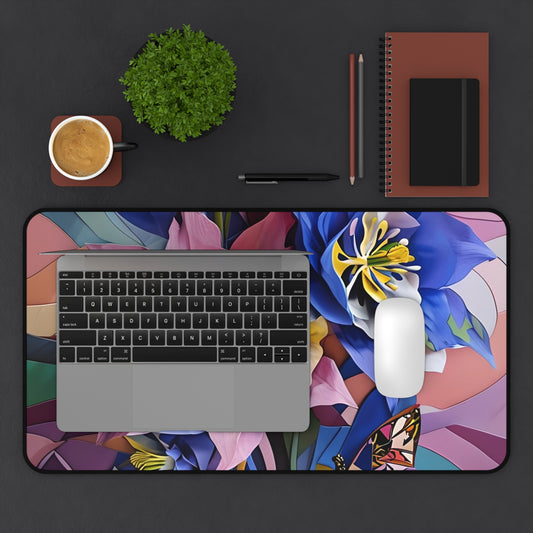 Blue Columbine Carnivale desk mat in workspace with keyboard showing colorful floral design