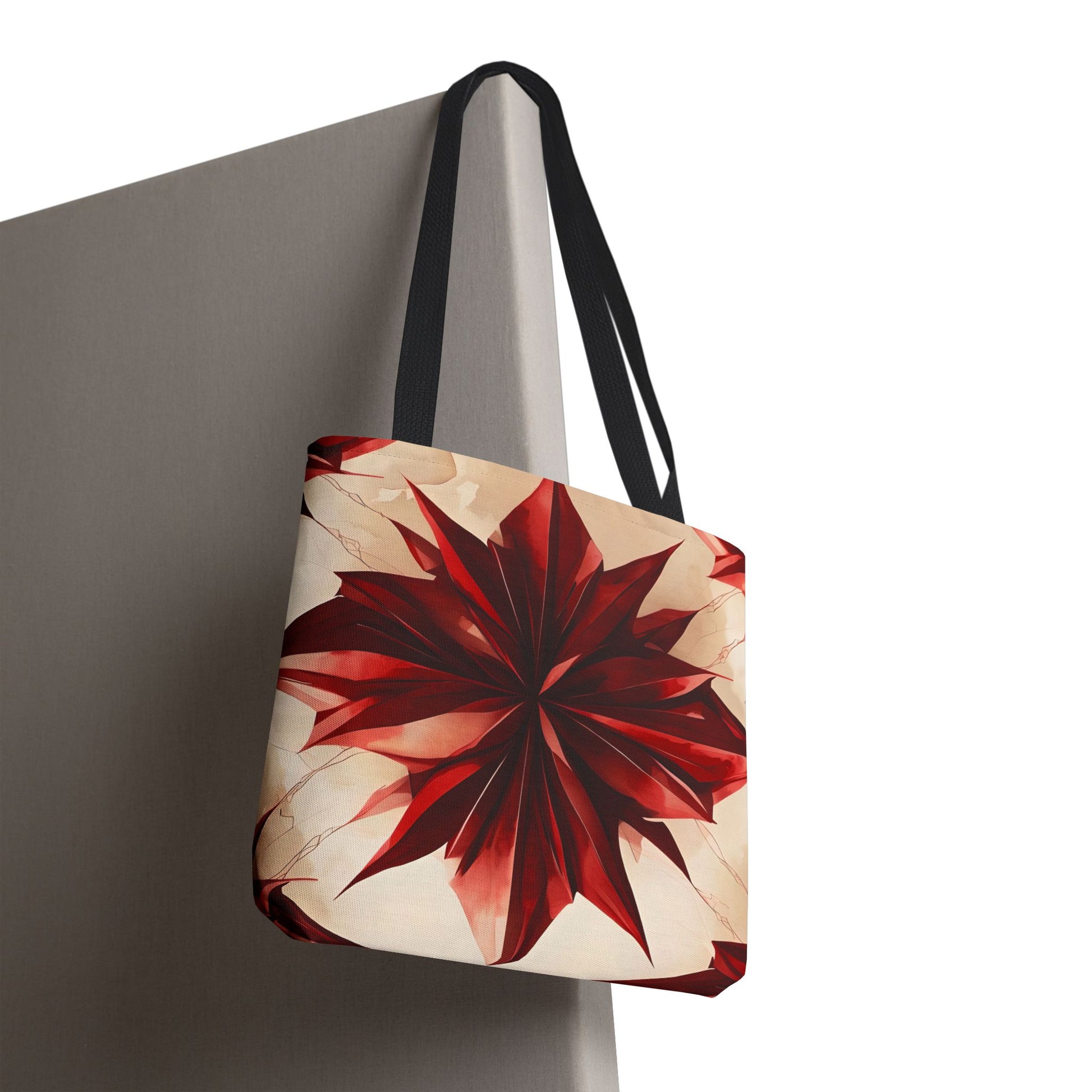 Ruby Compass canvas tote bag hanging with striking red compass geometric artwork