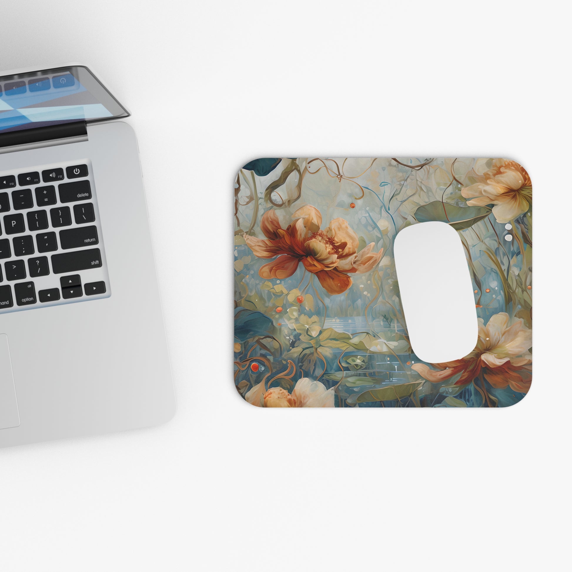 Waterlily Dreamscape mouse pad beside laptop displaying waterlily pond artwork