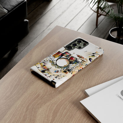 Beatline Samsung Galaxy drum set phone case on wooden desk beside laptop and notebook, music lover lifestyle flat lay
