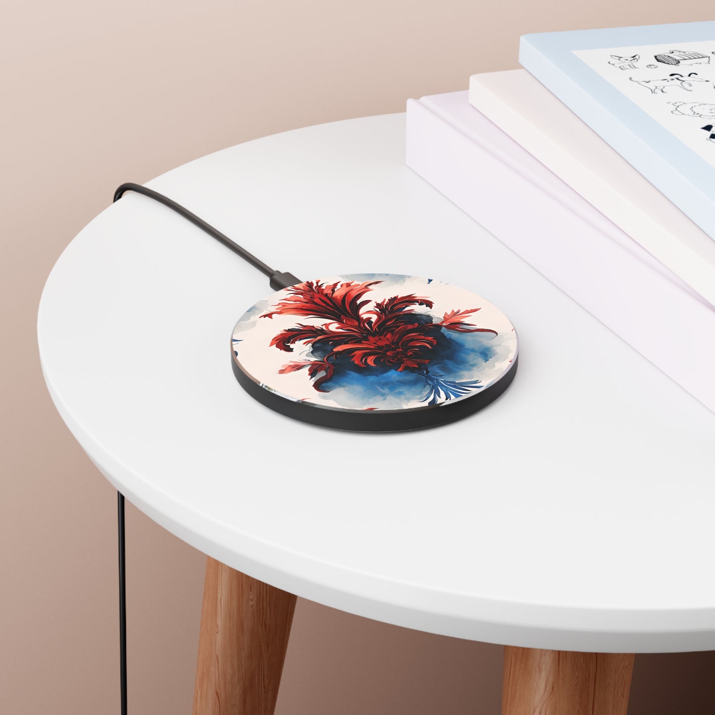 Crimson Plume red, white and blue floral art Qi wireless charger on bedside table with books