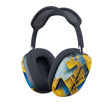 Golden Ascent AirPods Max cover with bold yellow and blue geometric blocks and gold accents, angled view on Apple AirPods Max headphones