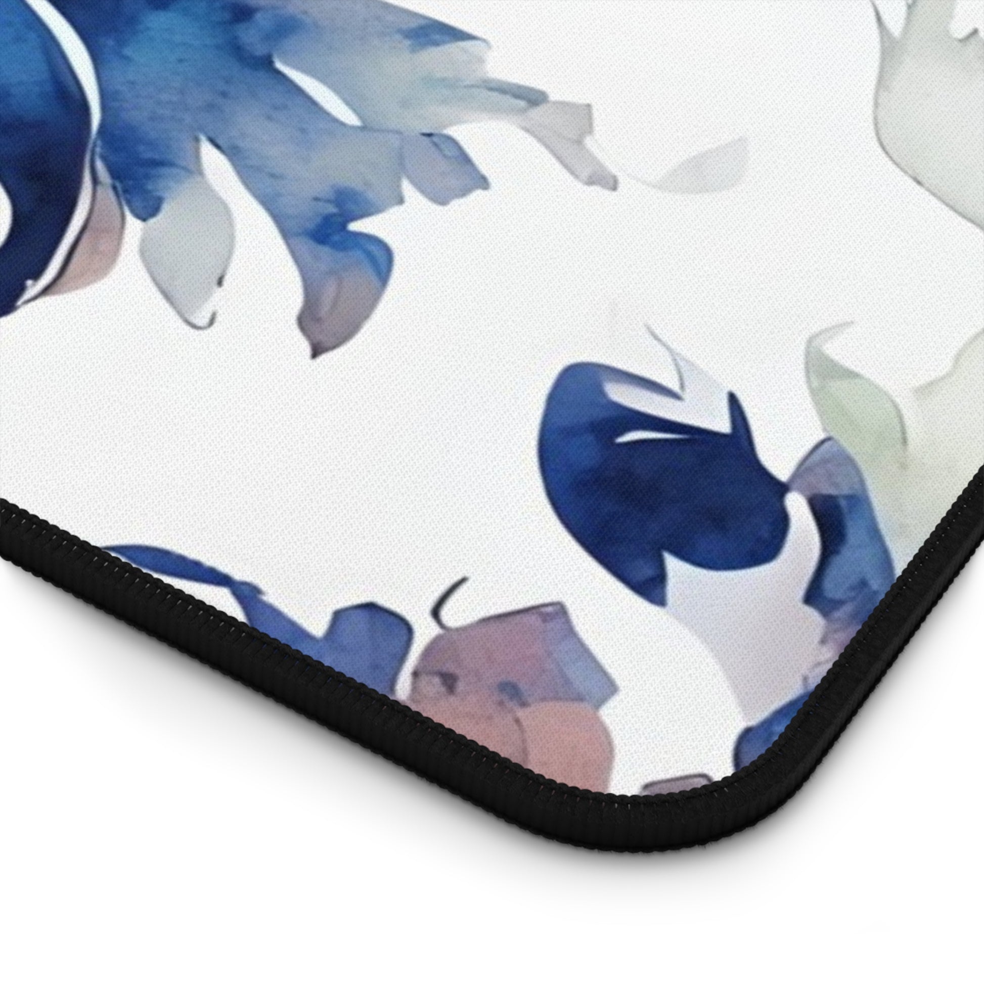 Close-up of Delft Reverie desk mat showing detailed Delft-style floral pattern