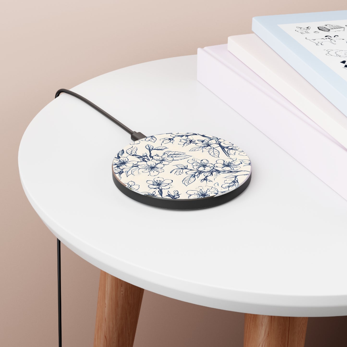 Blossom Sketch blue botanical sketch art Qi wireless charger on bedside table with books