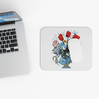 Bouquet Brilliance mouse pad beside laptop displaying floral bouquet artwork