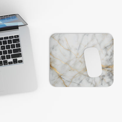 Golden Vein Marble mouse pad beside laptop displaying marble vein design