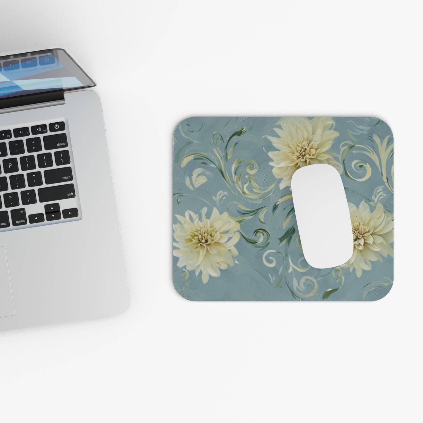 Golden Dahlia Trio mouse pad beside laptop displaying dahlia flower design