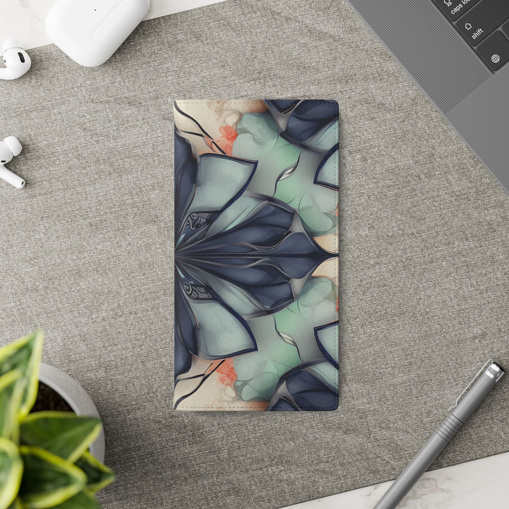 Midnight Mosaic Samsung Galaxy wallet flip phone case on a desk beside stationery featuring geometric floral mosaic design and folio card holder
