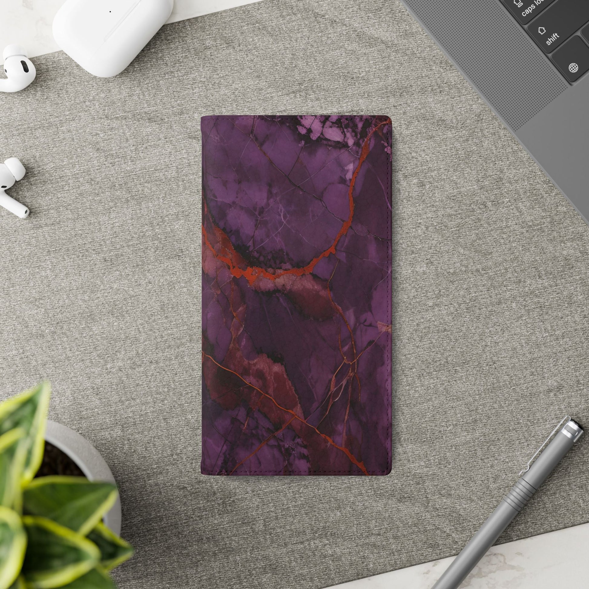 Amethyst Current Samsung Galaxy wallet flip phone case on a desk beside stationery featuring purple marble design and folio card holder