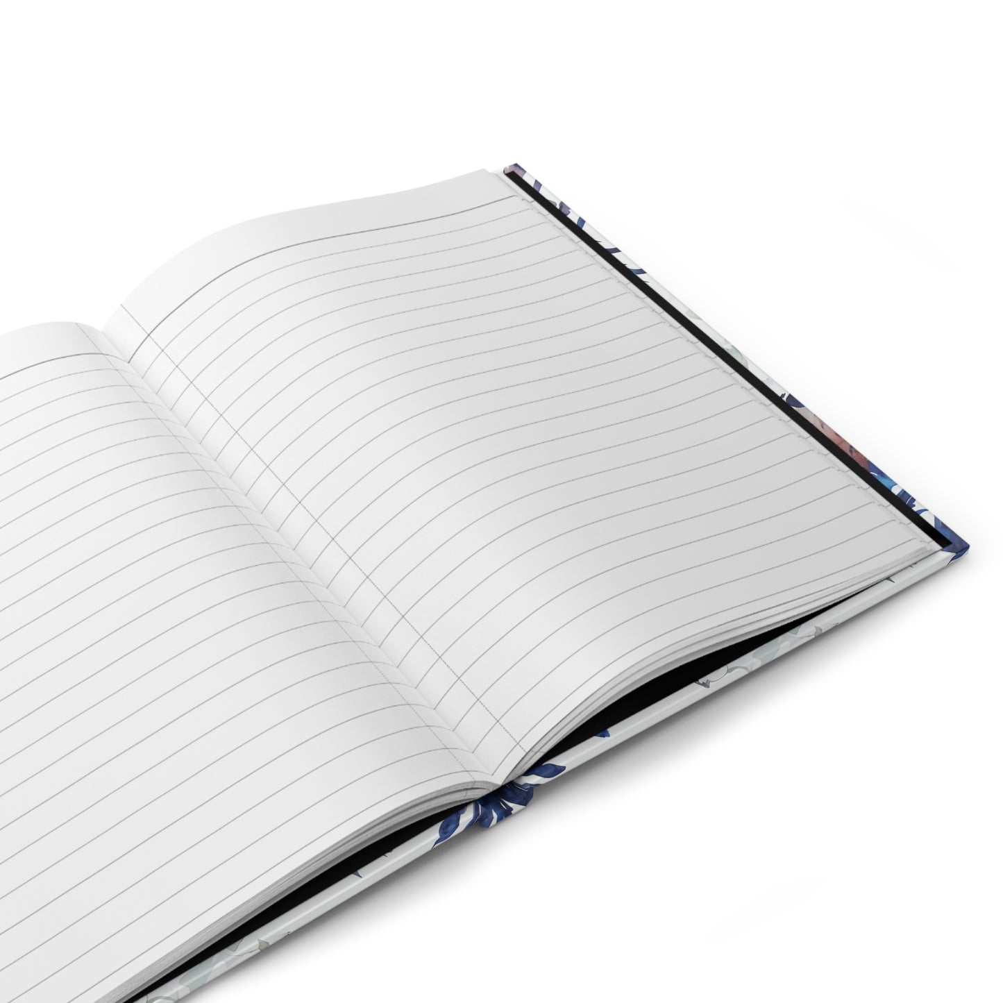 Open hardcover journal showing lined writing pages inside Delft Reverie notebook
