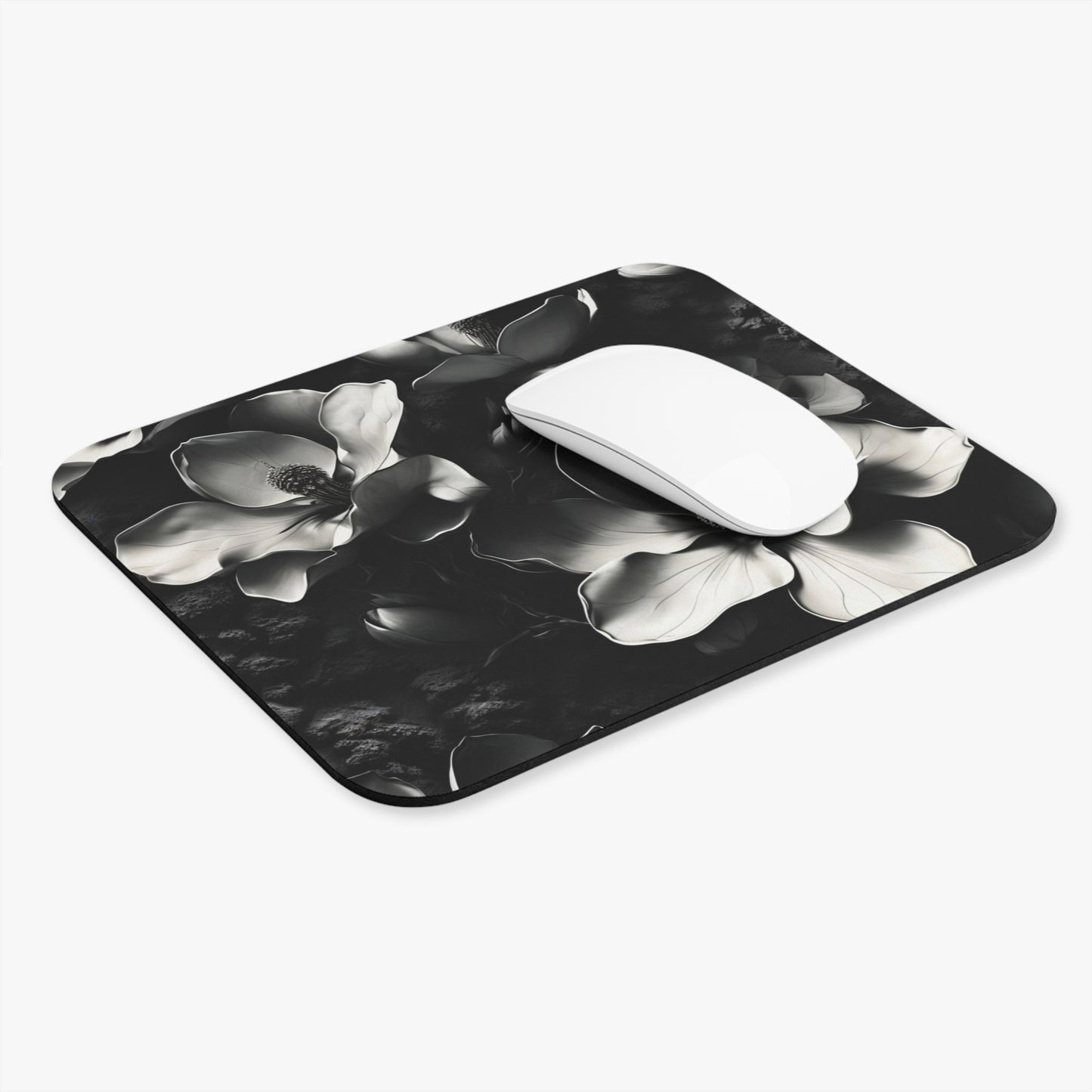 Monochrome Magnolia mouse pad in workspace with mouse showing magnolia flower design