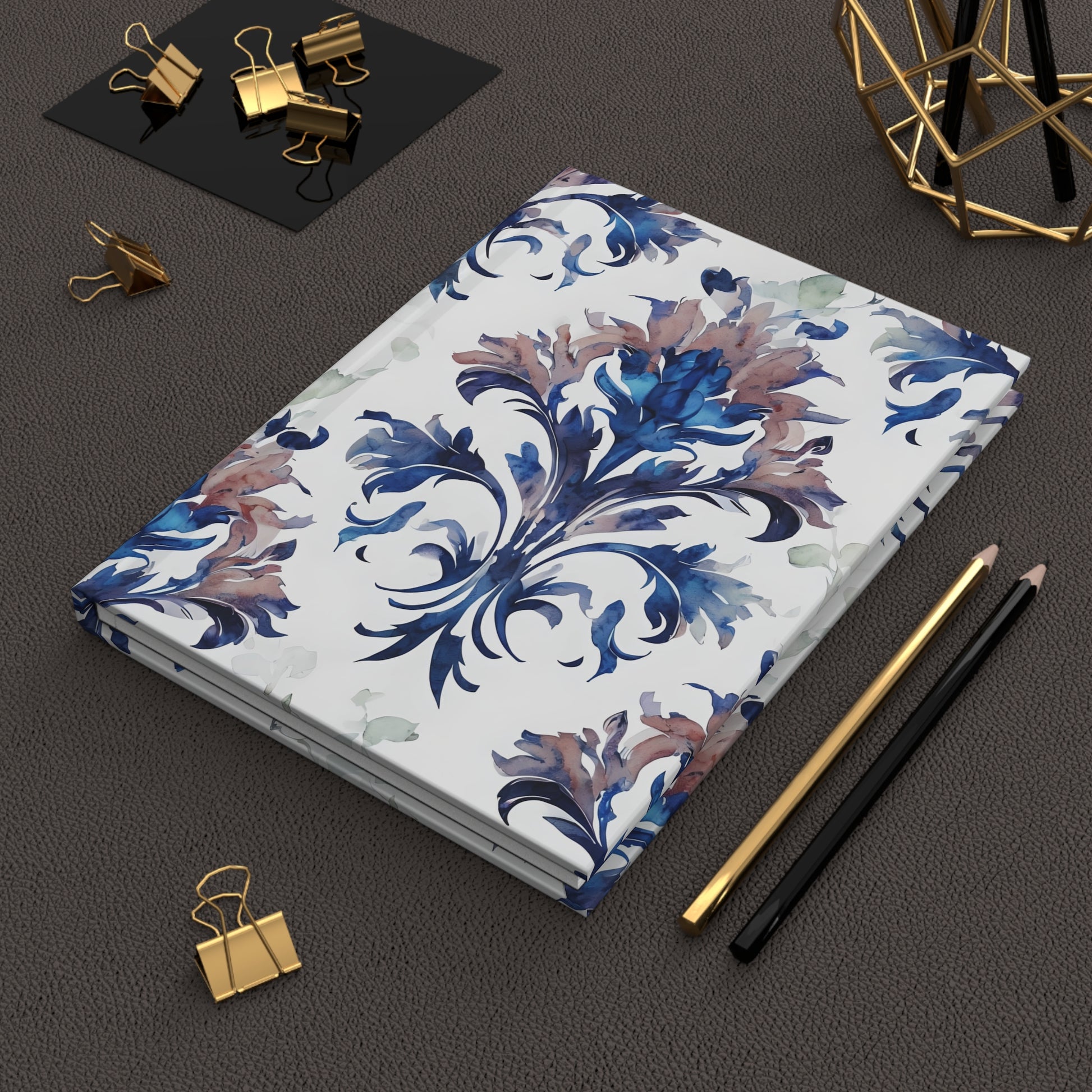 Delft Reverie hardcover journal on desk with pencils and stationery