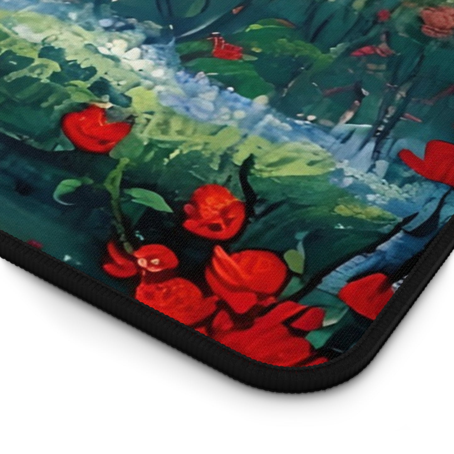 Close-up of Crimson Blossom desk mat showing detailed red blossom artwork