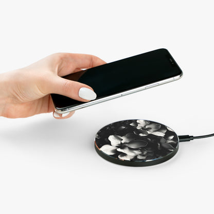Hand placing smartphone on Monochrome Magnolia black and white magnolia design Qi wireless charger