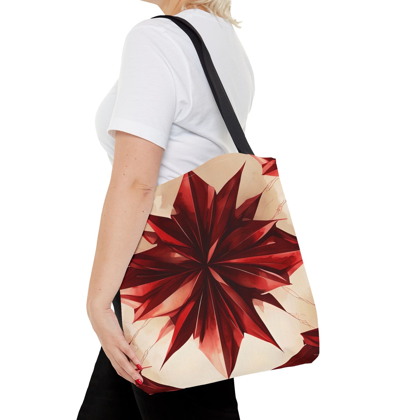 Ruby Compass canvas tote bag worn over shoulder showing vibrant red compass pattern