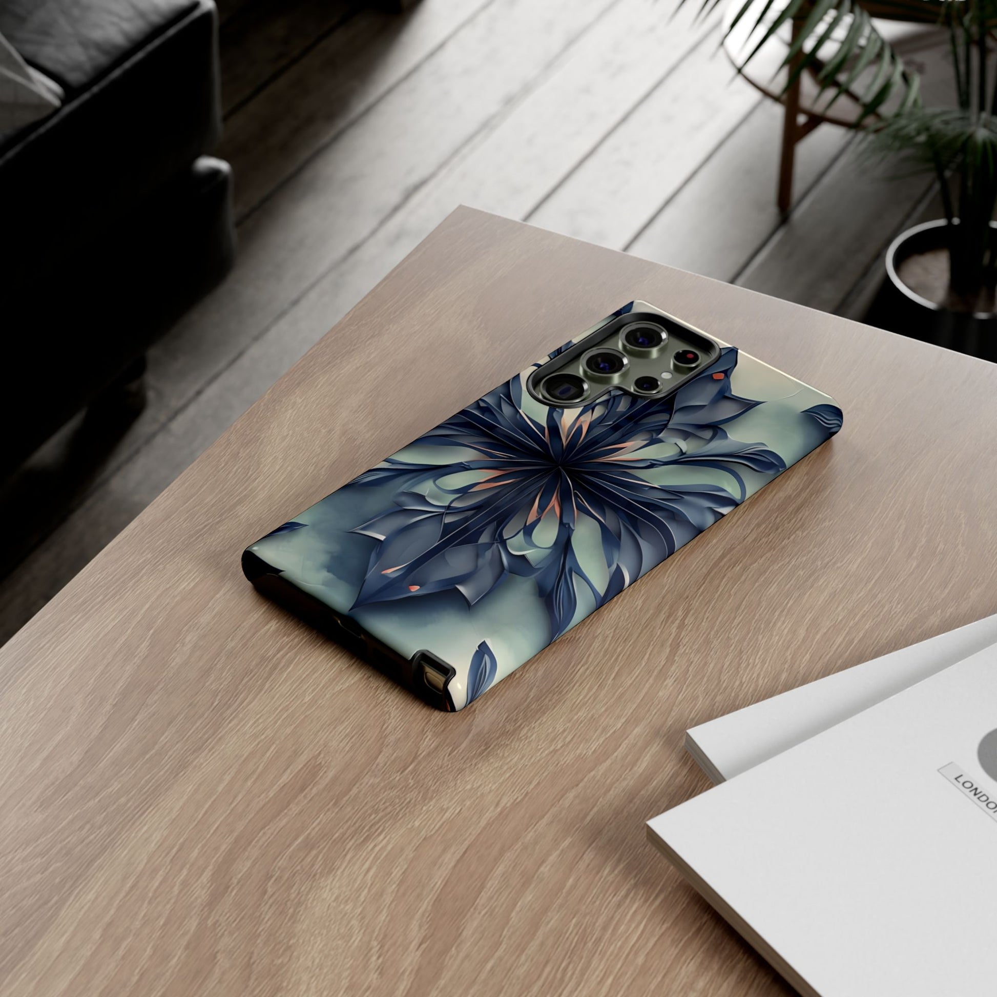 Frosted Indigo Bloom Samsung Galaxy floral phone case on wooden desk beside laptop and notebook, elegant lifestyle flat lay