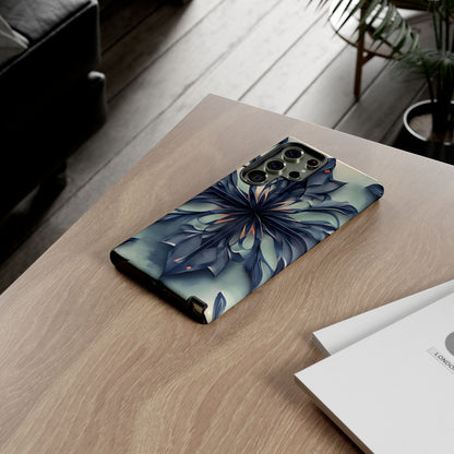 Frosted Indigo Bloom Samsung Galaxy floral phone case on wooden desk beside laptop and notebook, elegant lifestyle flat lay