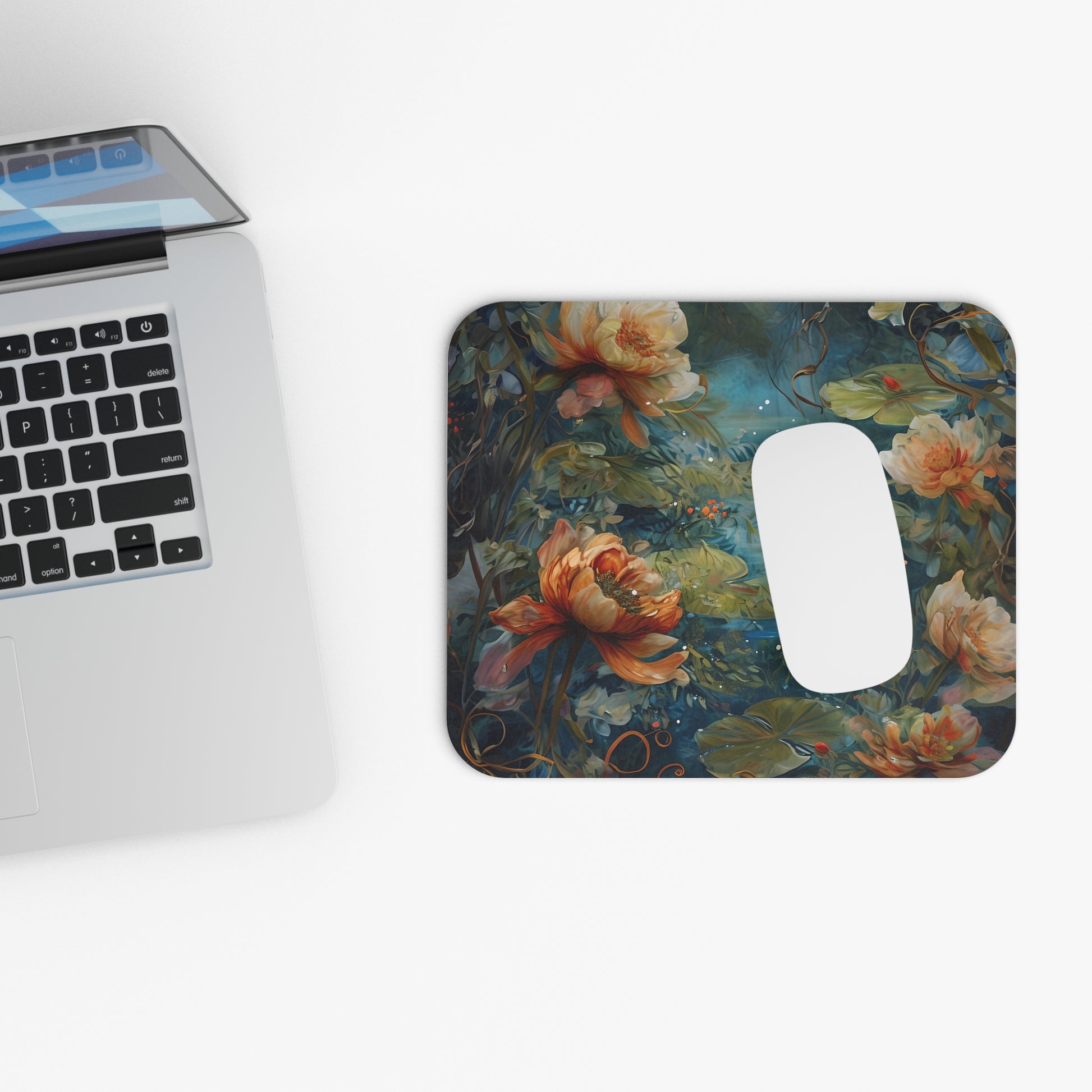 Waterlily Nocturne mouse pad beside laptop displaying waterlily pond artwork