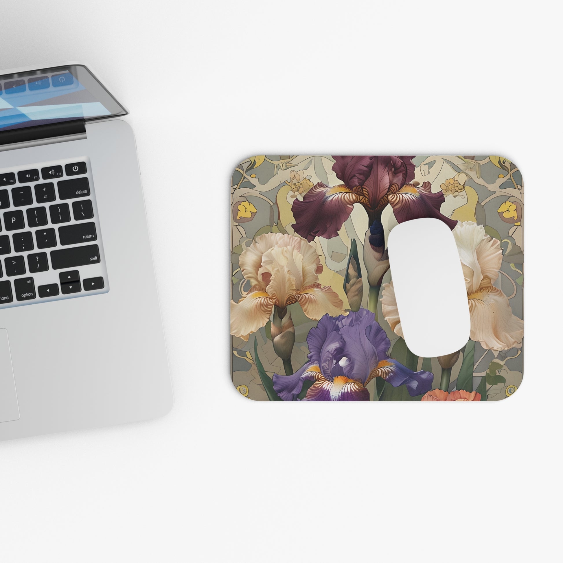 Iris Reverie mouse pad beside laptop displaying iris flower artwork