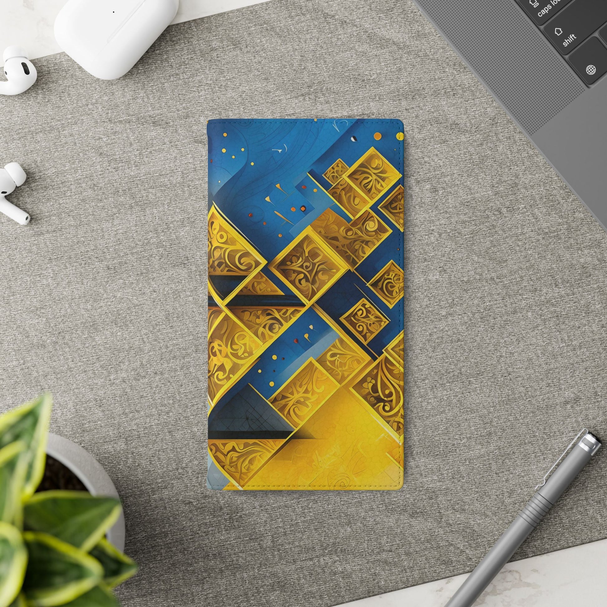 Golden Ascent Samsung Galaxy wallet flip phone case on a desk beside stationery featuring abstract gold geometric design and folio card holder