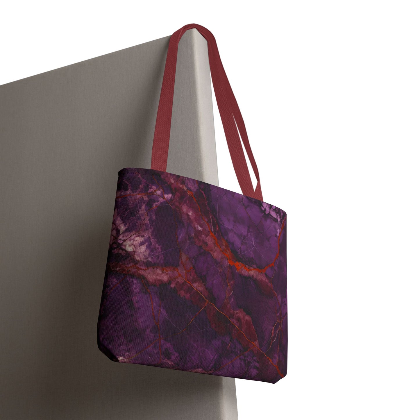 Amethyst Current canvas tote bag hanging with dynamic red and purple current pattern
