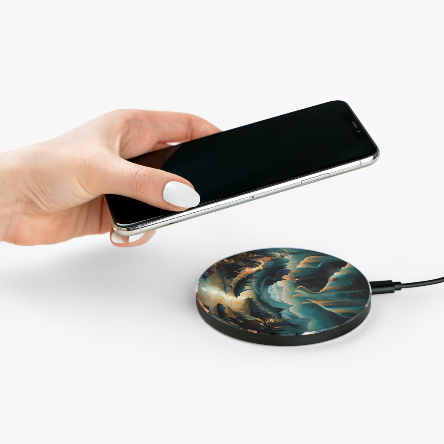 Hand placing smartphone on Aurora Dreamscape northern lights mountain landscape Qi wireless charger