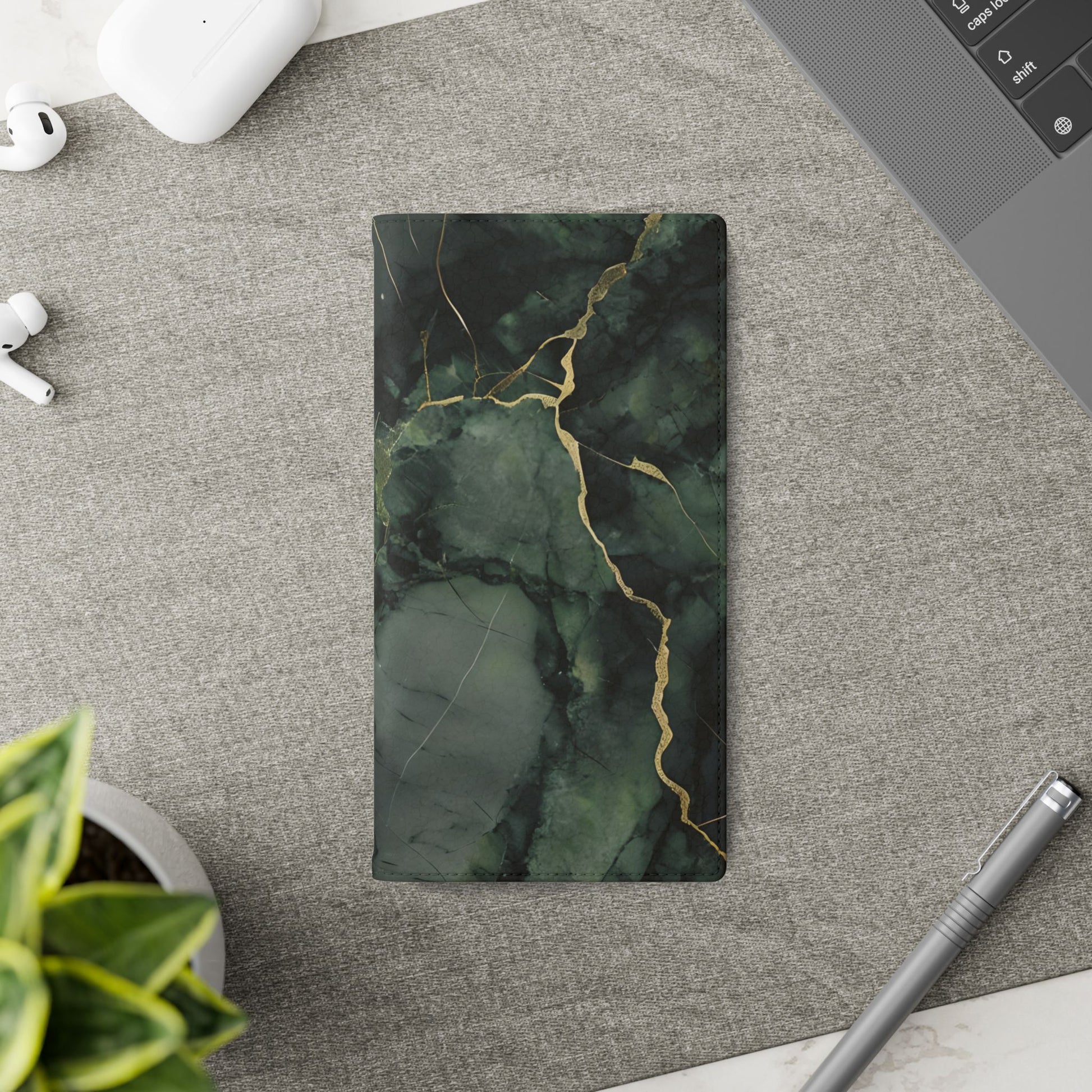 Verdant Vein Samsung Galaxy wallet flip phone case on a desk beside stationery featuring green marble design and folio card holder