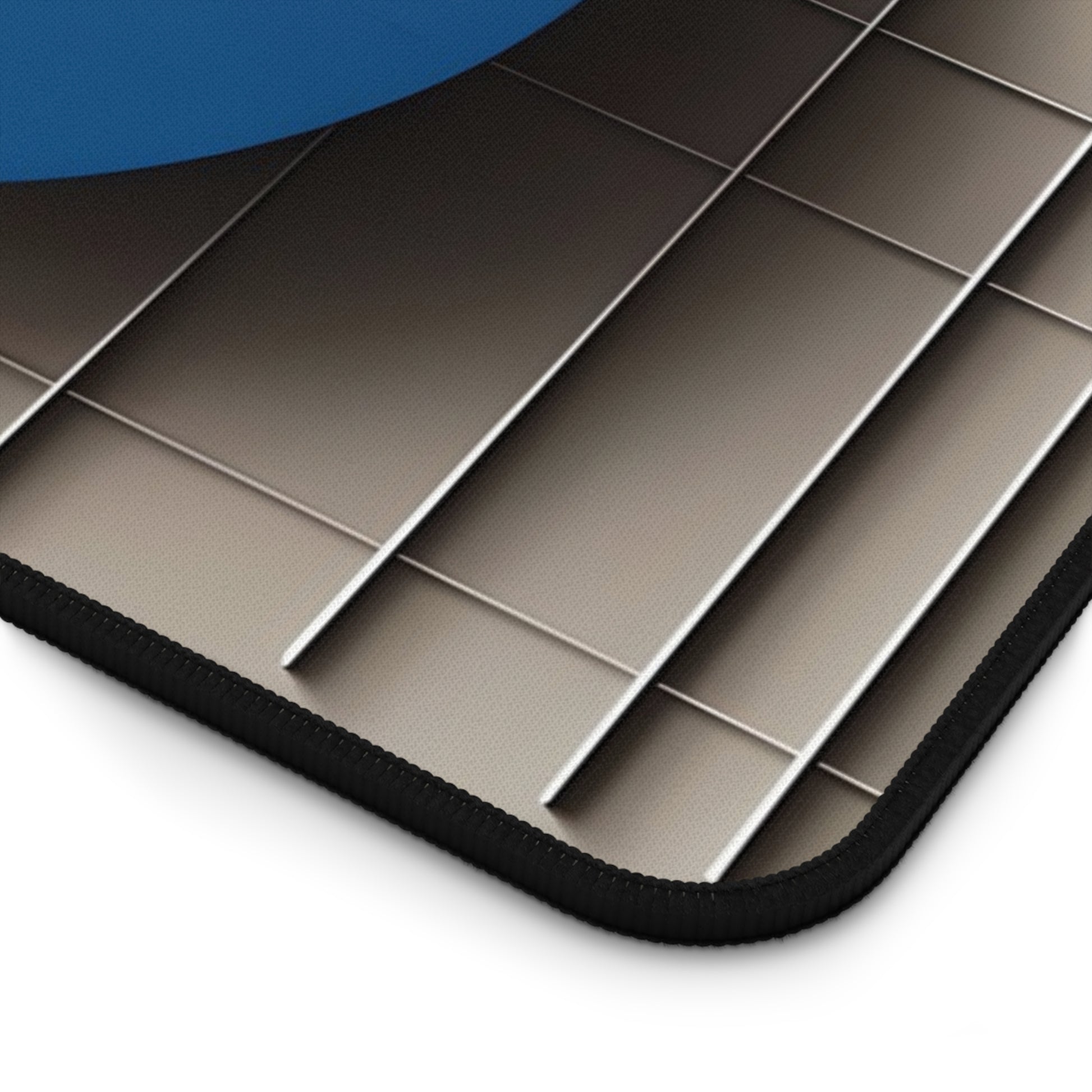 Close-up of Chromatic Construct desk mat showing detailed geometric color pattern