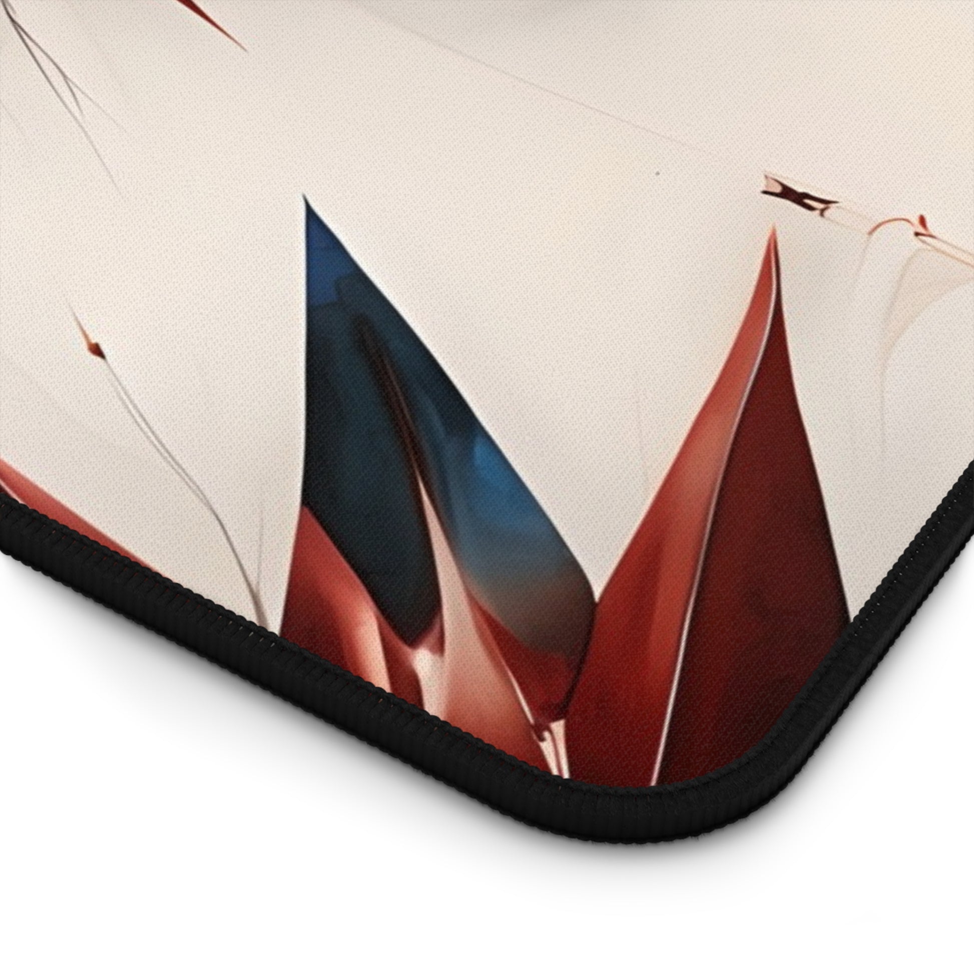 Close-up of Garnet Starburst desk mat showing detailed red, white and blue starburst pattern