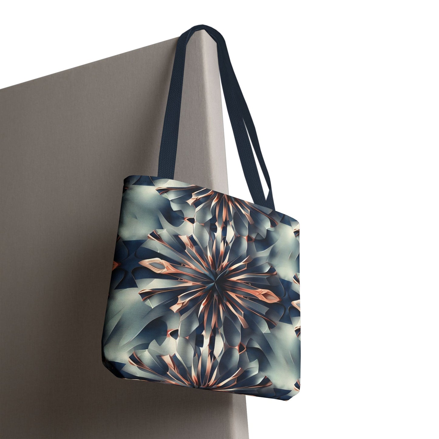 Obsidian Kaleidoscope canvas tote bag hanging with bold monochrome kaleidoscope design