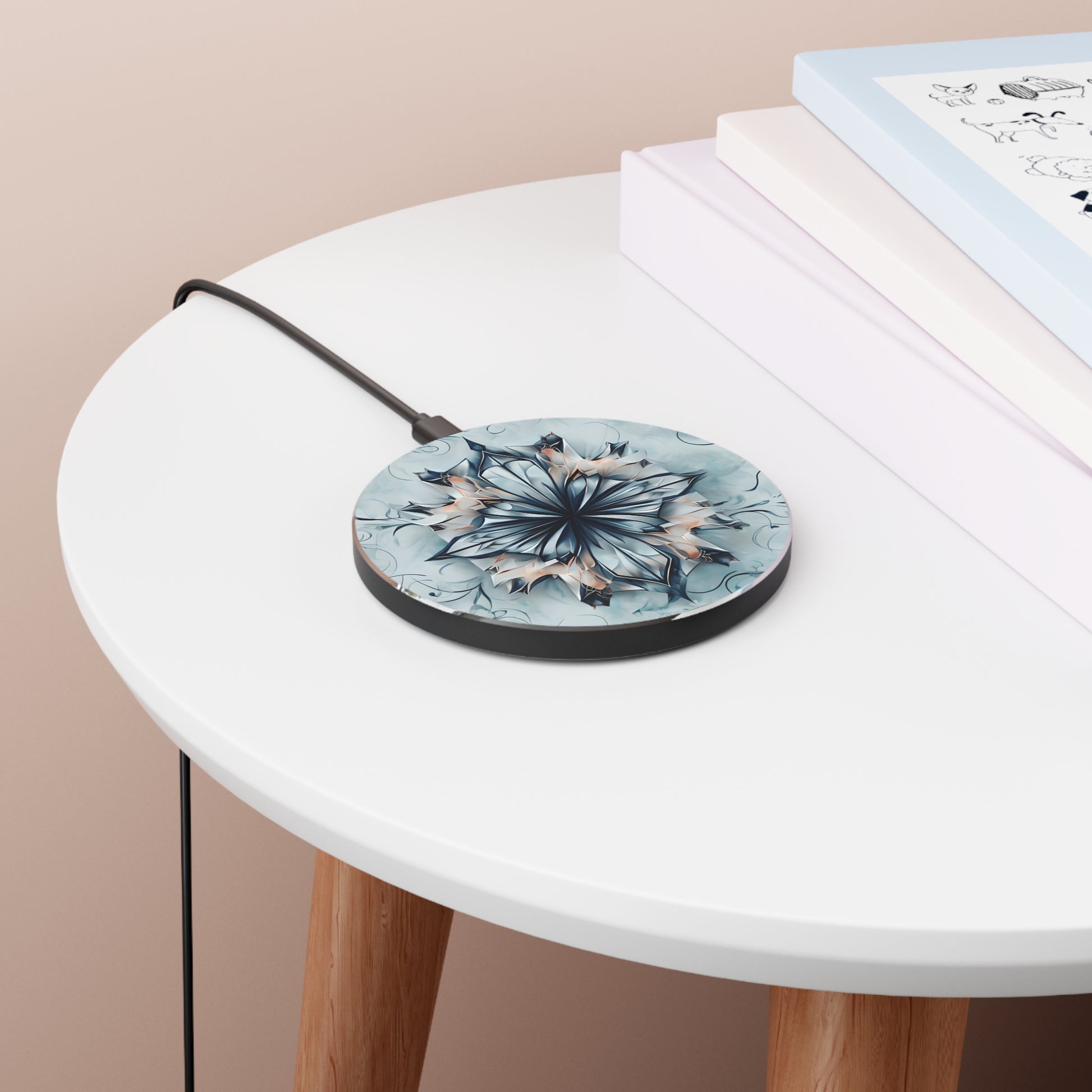 Indigo Mirage blue mandala art Qi wireless charger on bedside table with books