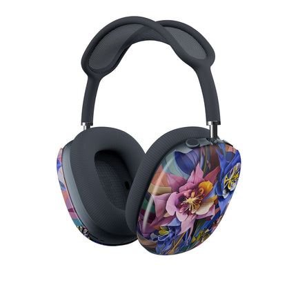 Blue Columbine Carnivale AirPods Max cover with vivid purple and blue columbine flowers, golden butterfly, and deep navy background, angled view on Apple AirPods Max headphones