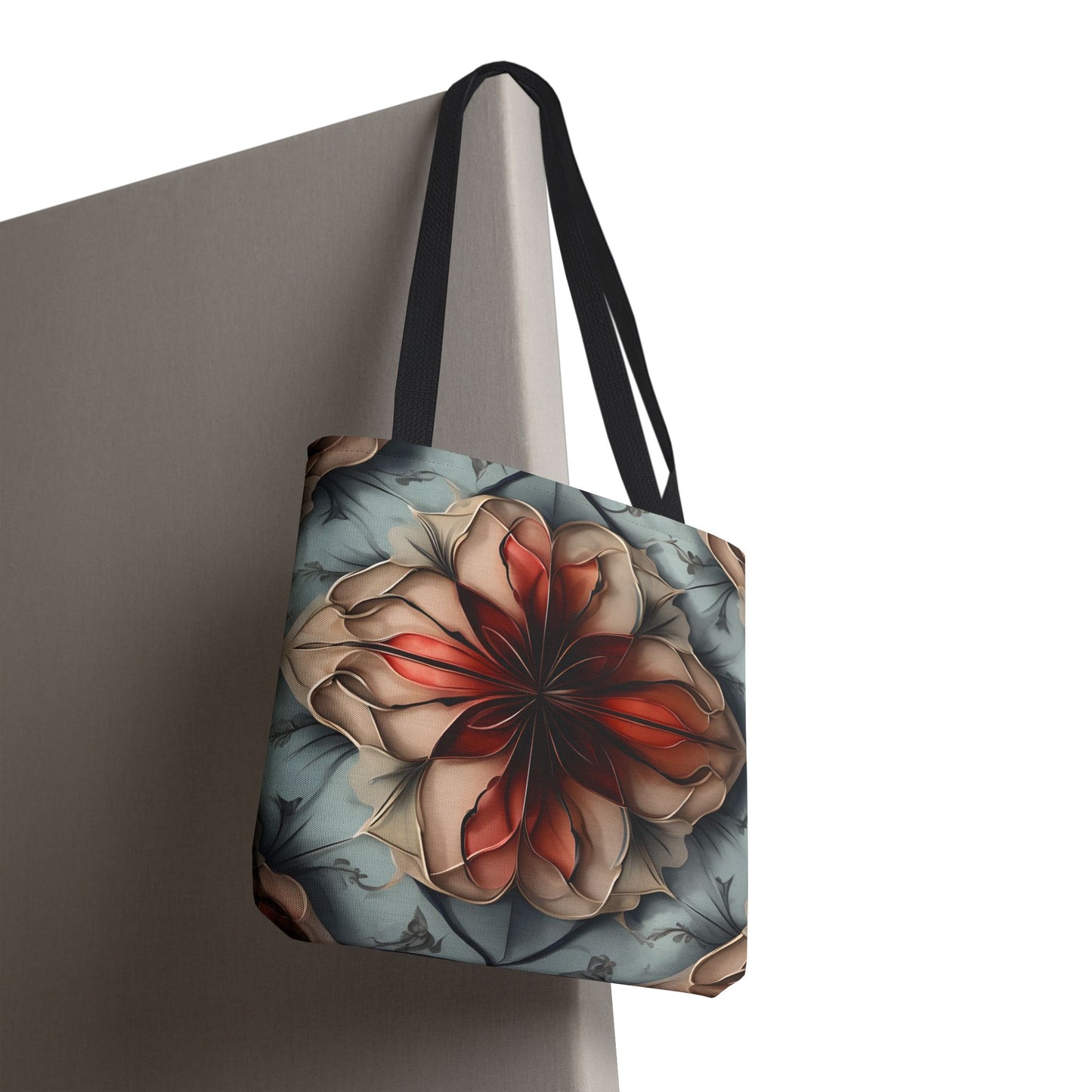 Ember Bloom canvas tote bag hanging with dramatic red floral bloom design