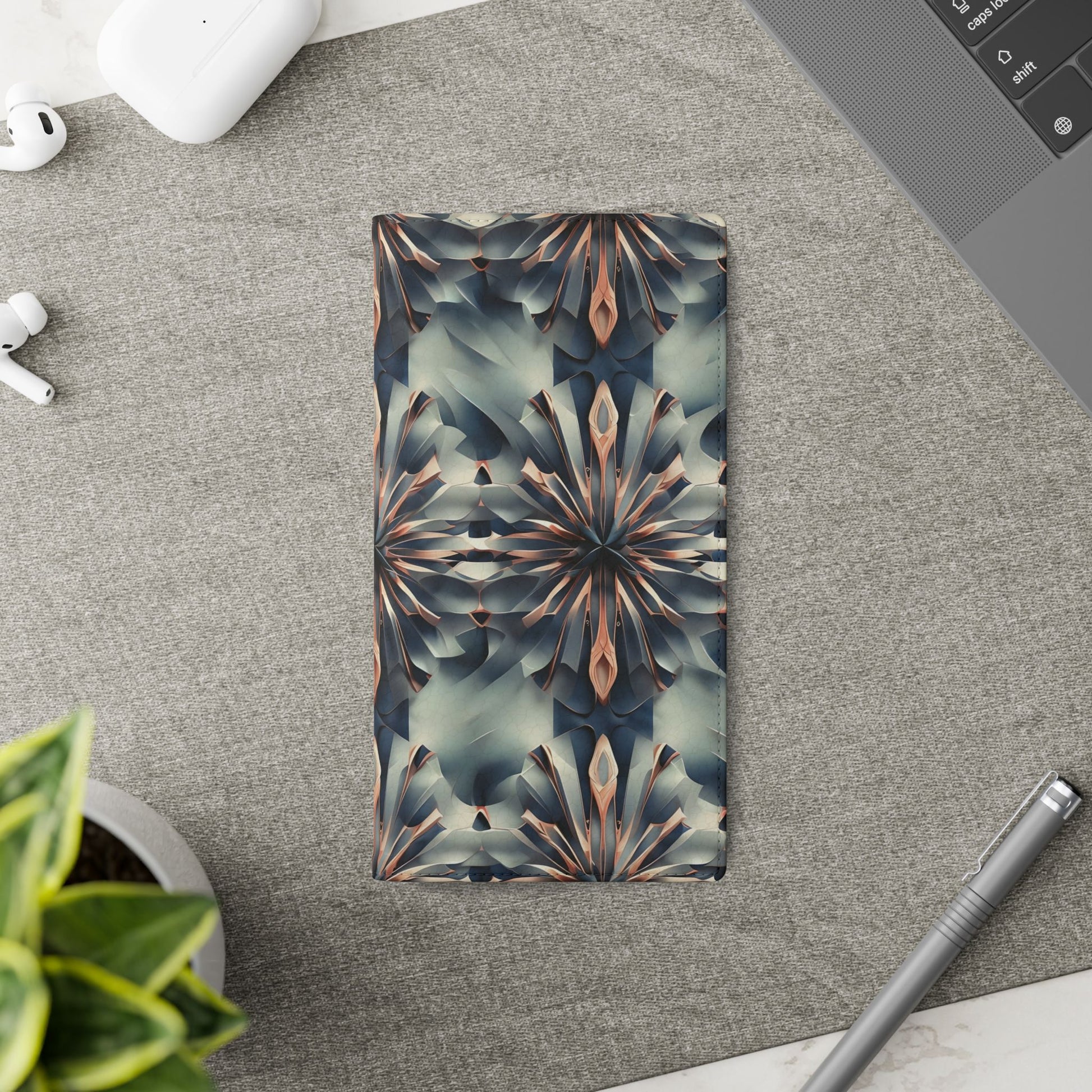 Obsidian Kaleidoscope Samsung Galaxy wallet flip phone case on a desk beside stationery featuring geometric kaleidoscope design and folio card holder