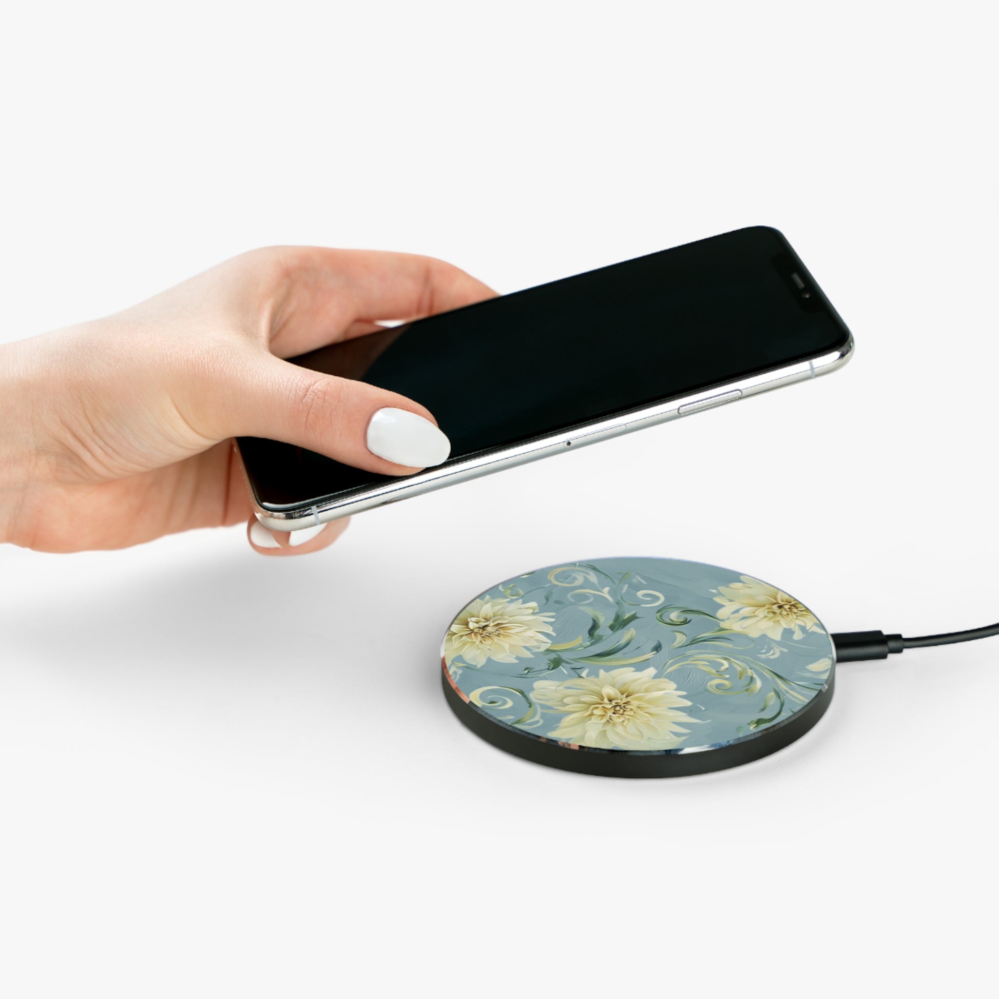 Hand placing smartphone on Golden Dahlia Trio dahlia floral design Qi wireless charger