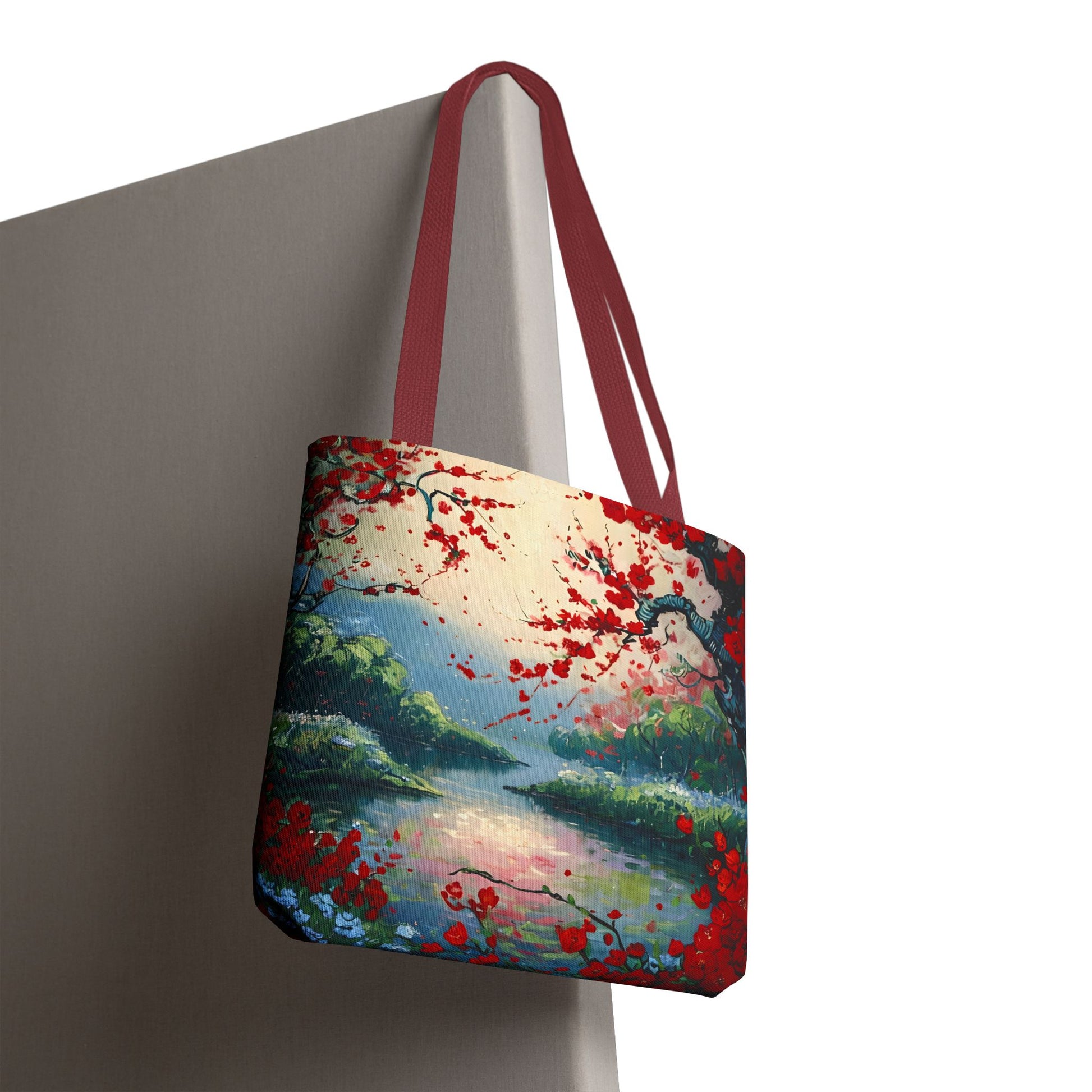 Crimson Blossom Lake canvas tote bag hanging with crimson blossom landscape artwork