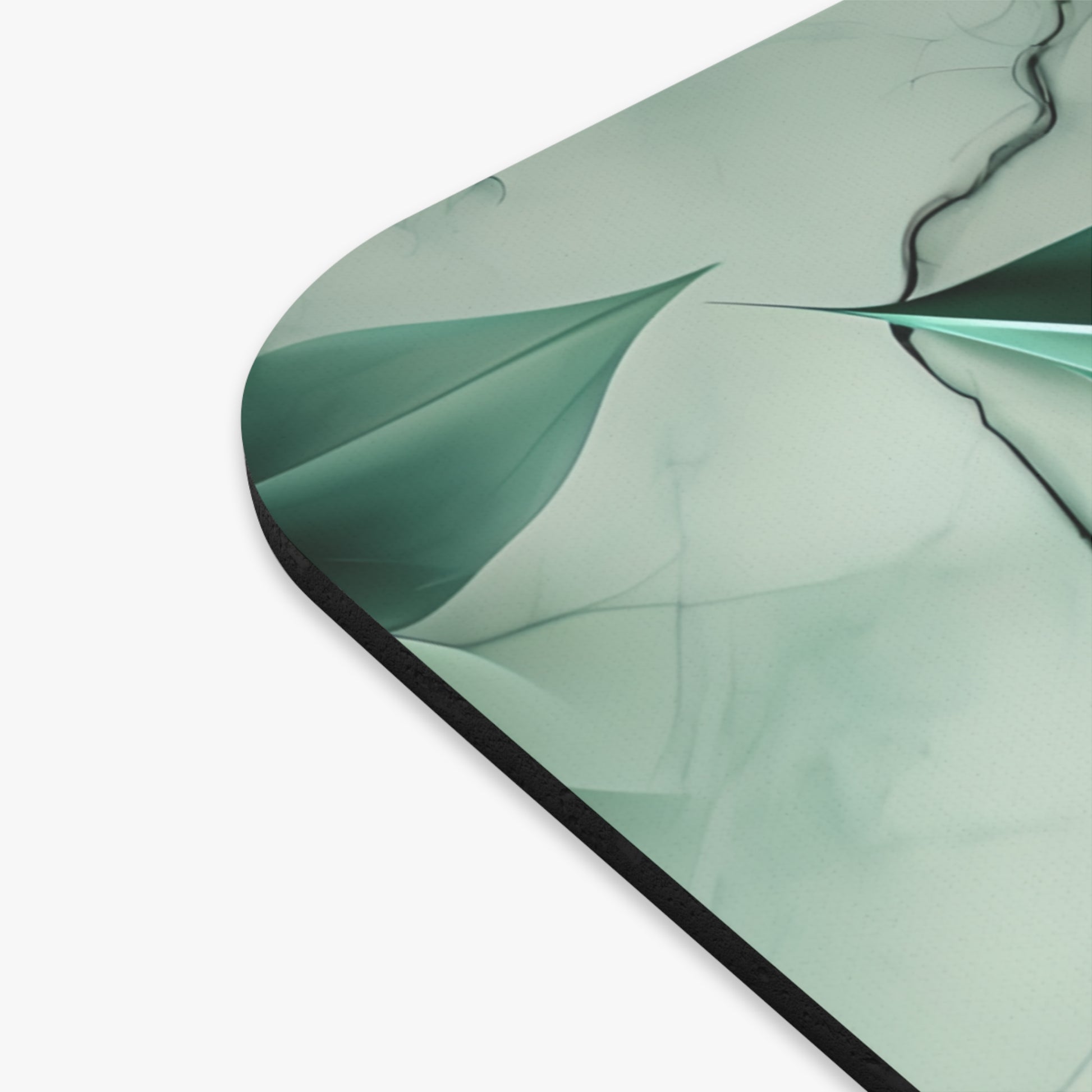 Close-up of Emerald Bloom mouse pad showing printed floral bloom detail