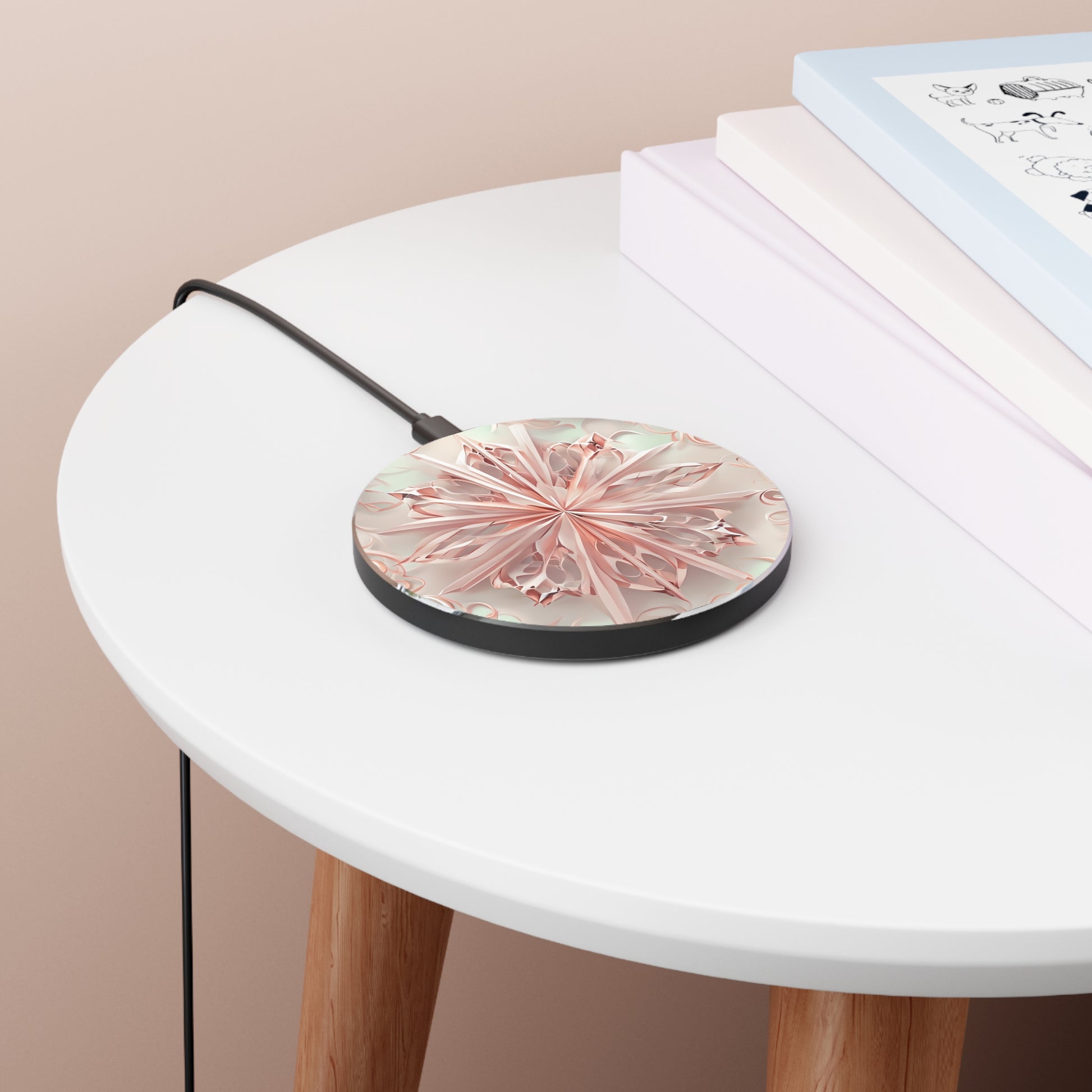 Blush Frost blush pink mandala art Qi wireless charger on bedside table with books