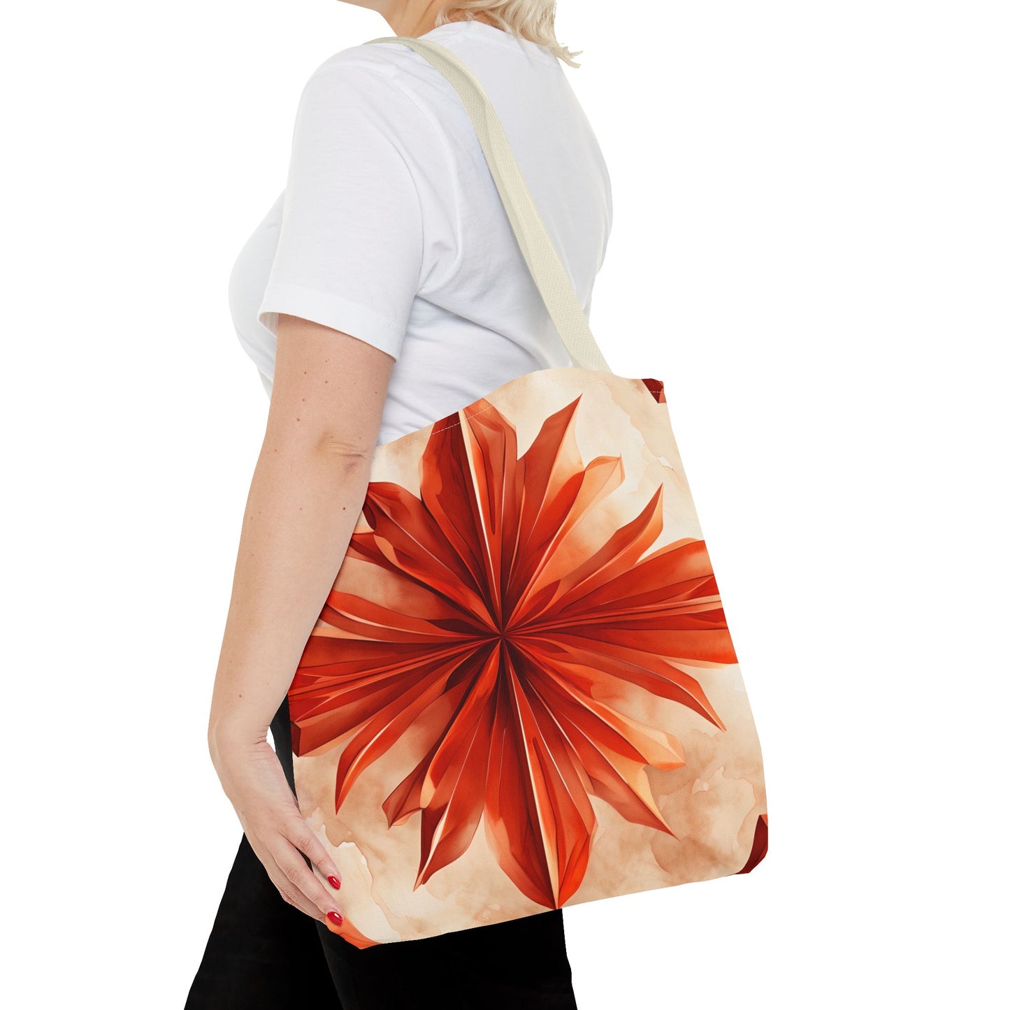Sunset Fleur canvas tote bag worn over shoulder showing bold orange flower artwork