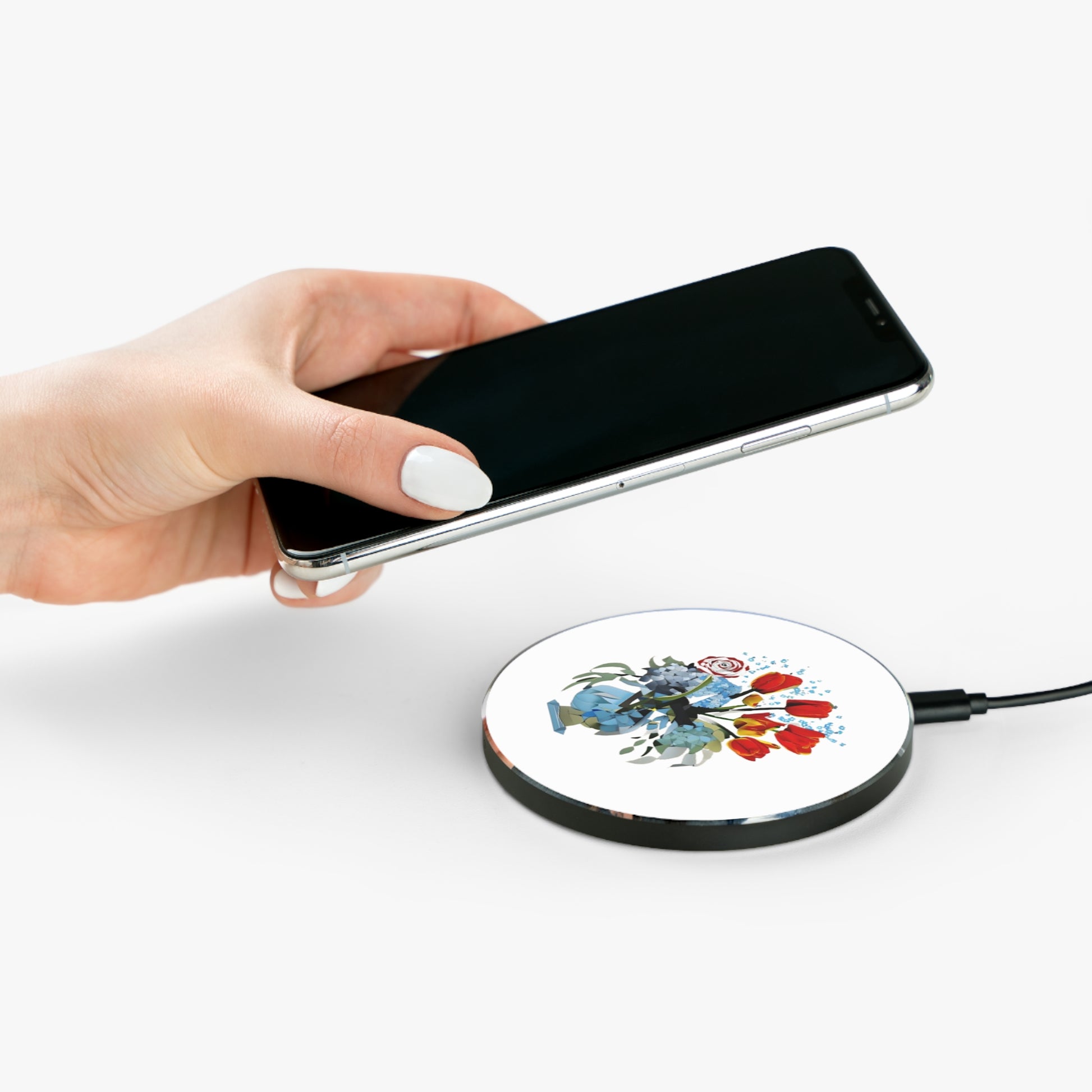 Hand placing smartphone on Bouquet Brilliance floral bouquet design Qi wireless charger