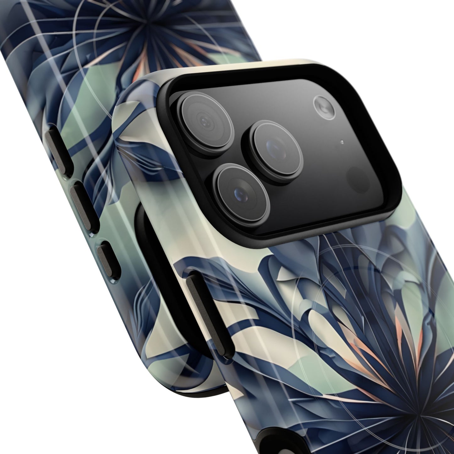 Frosted Indigo Bloom iPhone MagSafe case featuring a symmetrical abstract floral design in deep indigo and soft blue tones angled view with large camera cutouts.