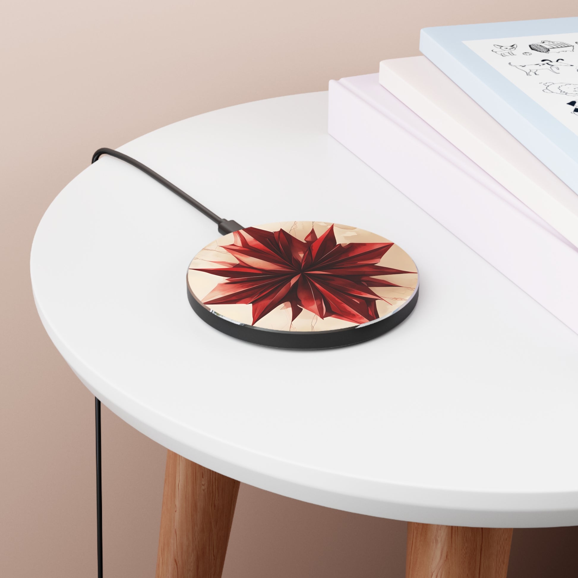 Ruby Compass red compass rose art Qi wireless charger on bedside table with books