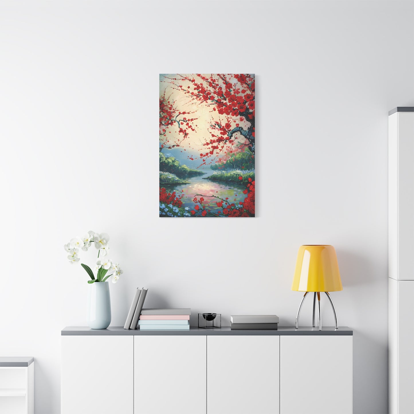 Crimson Blossom Lake wall art canvas displayed above a modern white console table in a bright living room