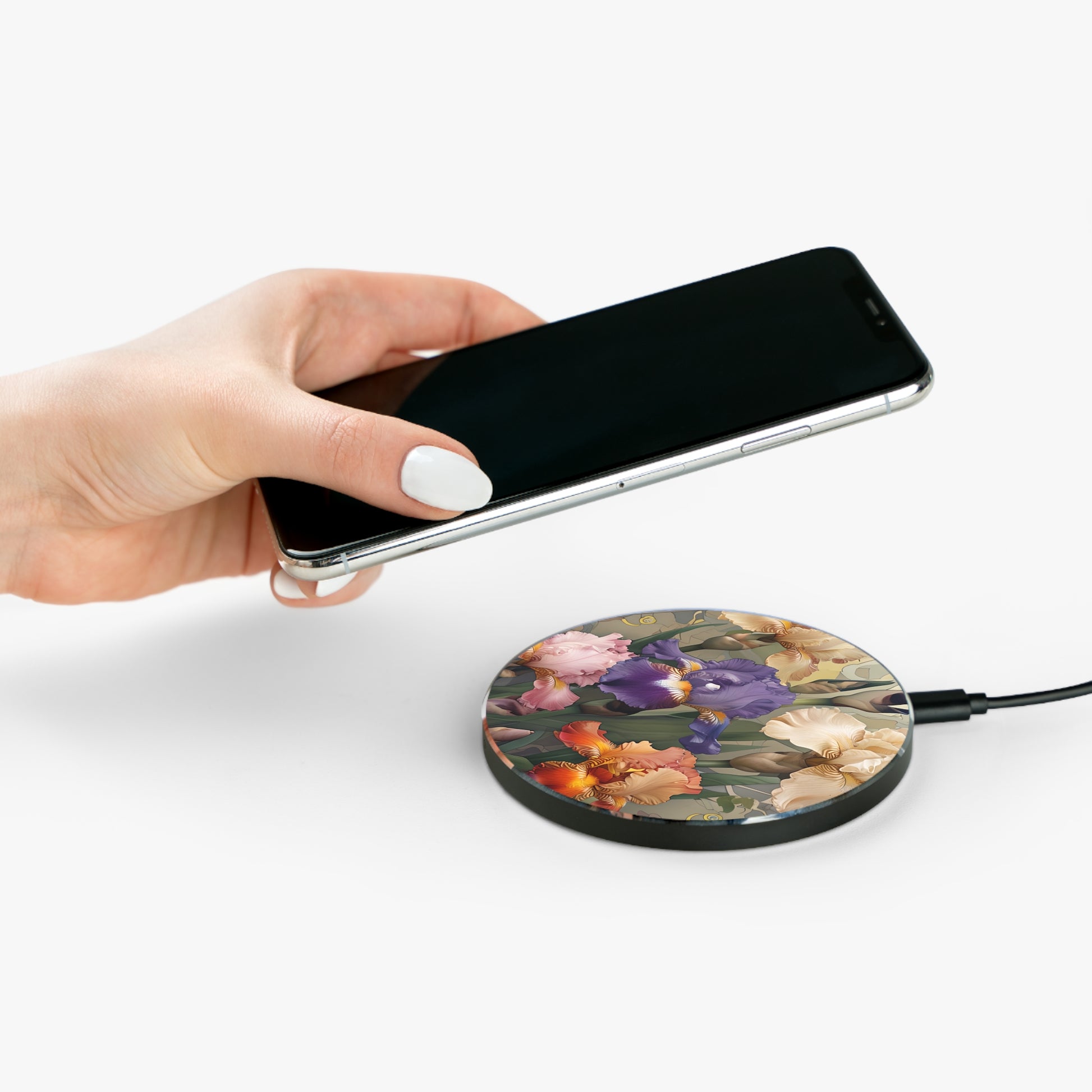 Hand placing smartphone on Iris Reverie iris floral design Qi wireless charger
