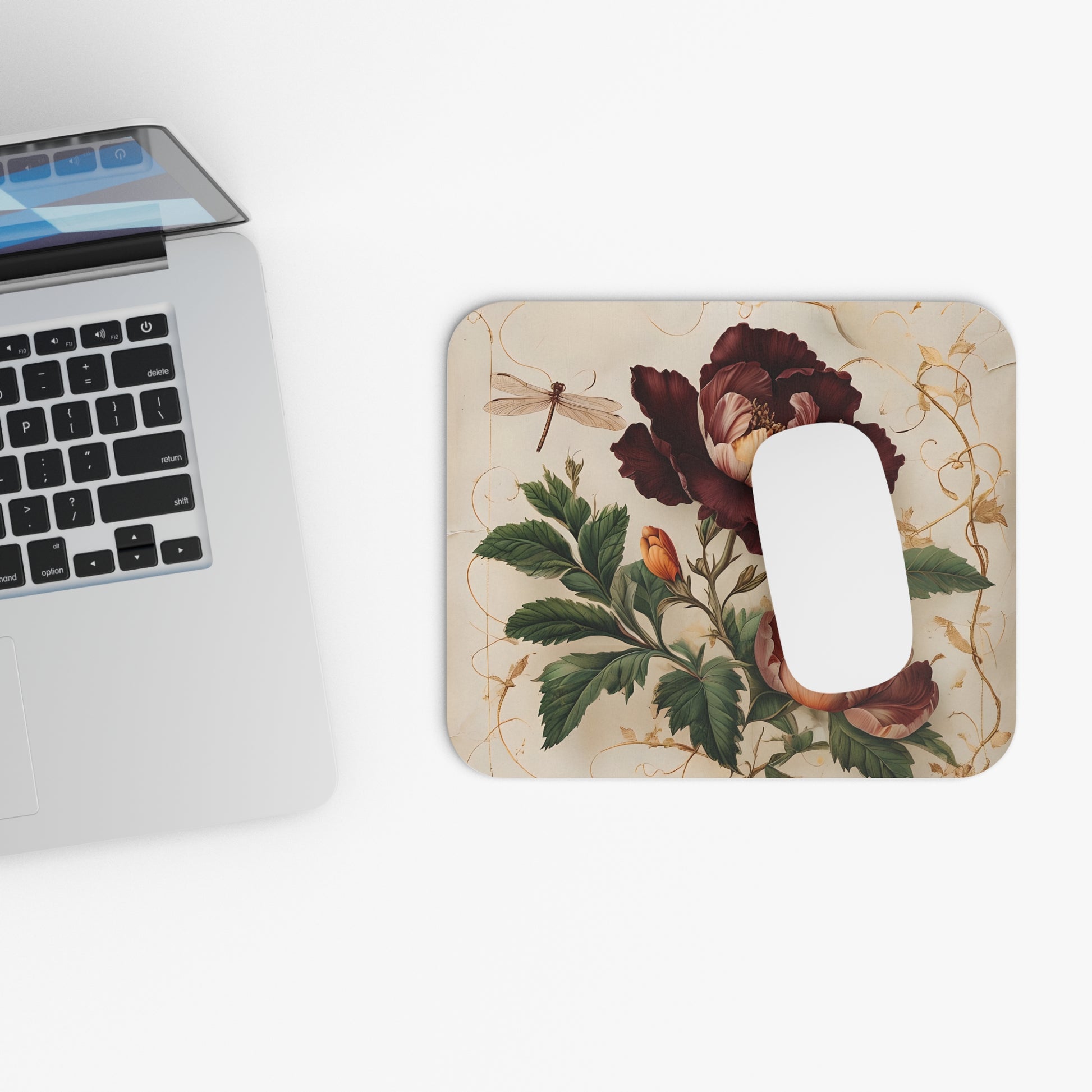 Vintage Burgundy Rose mouse pad beside laptop displaying burgundy rose design