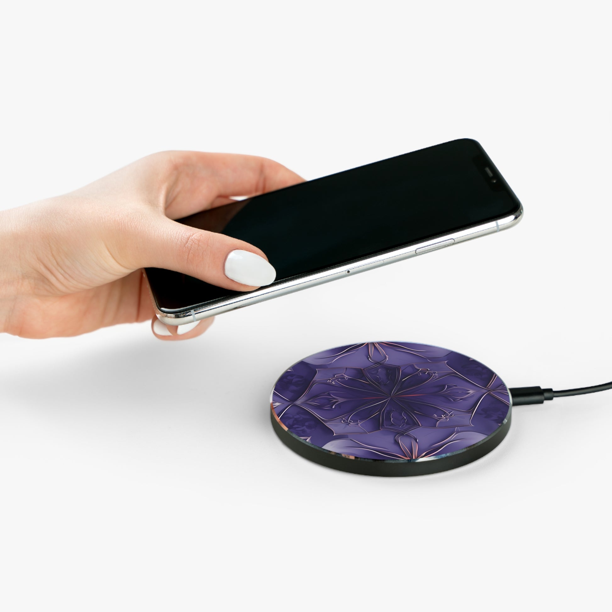 Hand placing smartphone on Violet Nebula purple mandala design Qi wireless charger