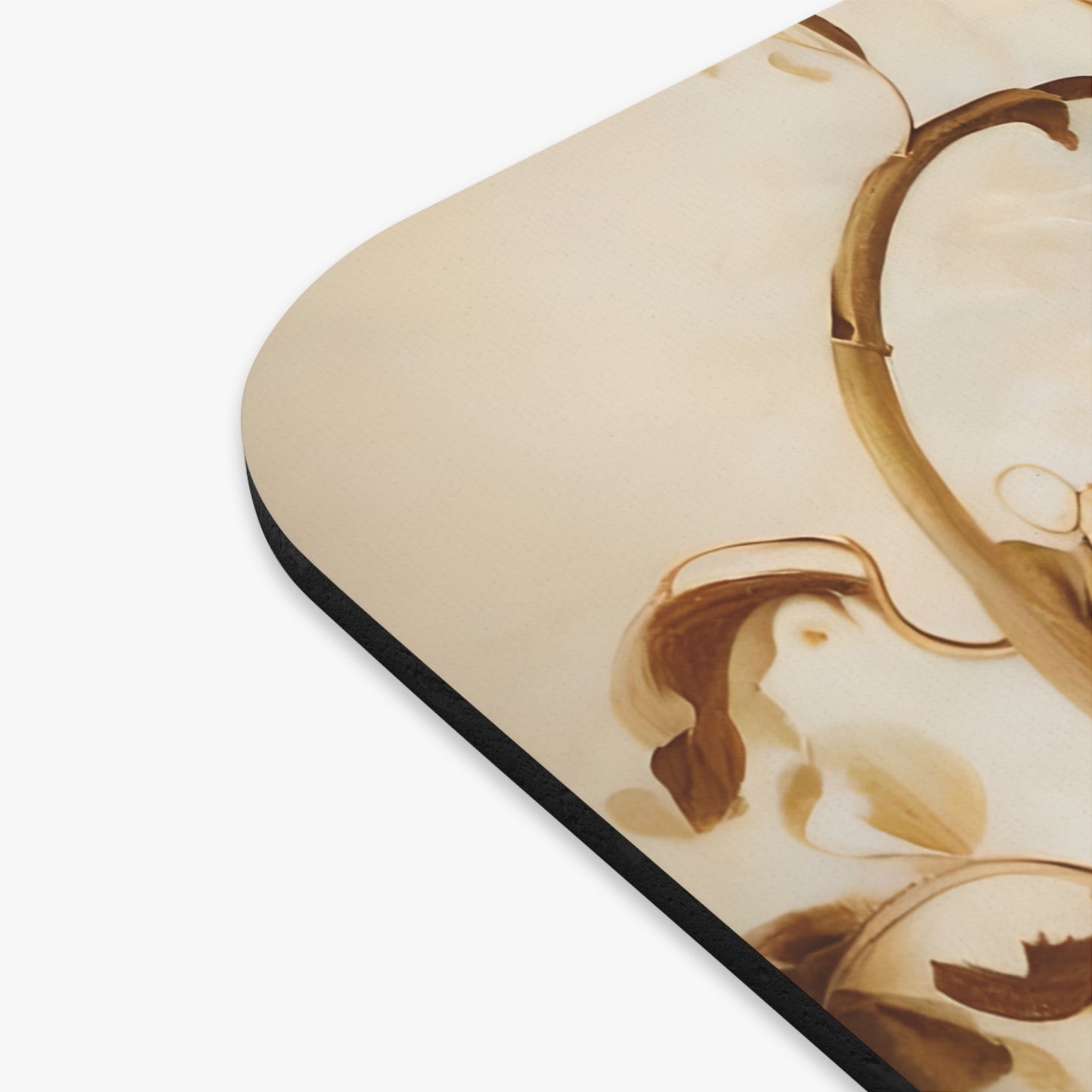 Close-up of Golden Plumage mouse pad showing printed feather illustration detail