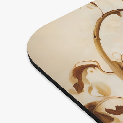 Close-up of Golden Plumage mouse pad showing printed feather illustration detail