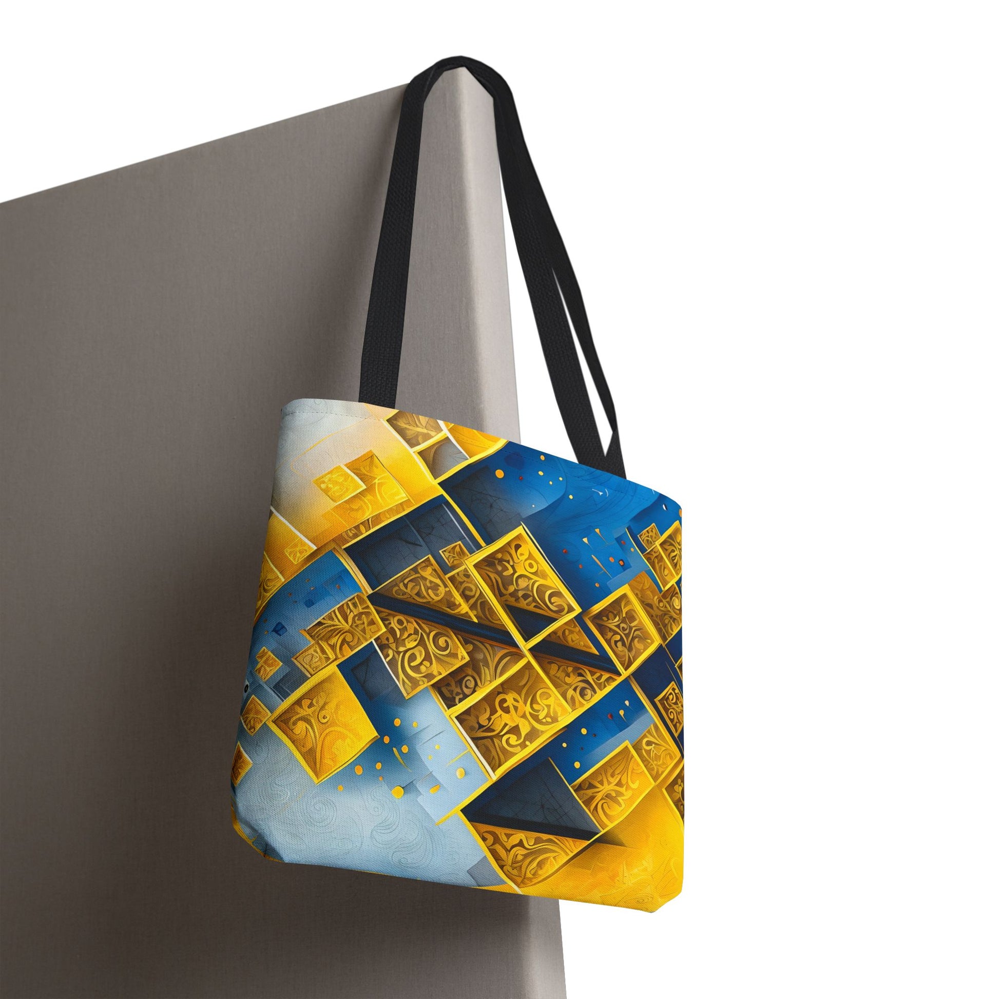Golden Ascent canvas tote bag hanging with striking gold geometric pattern artwork
