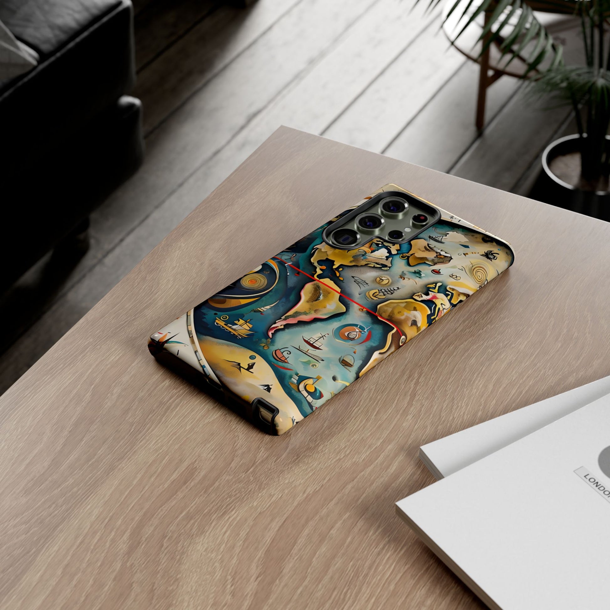 Celestial Map Samsung Galaxy phone case on wooden desk beside laptop and notebook, lifestyle flat lay